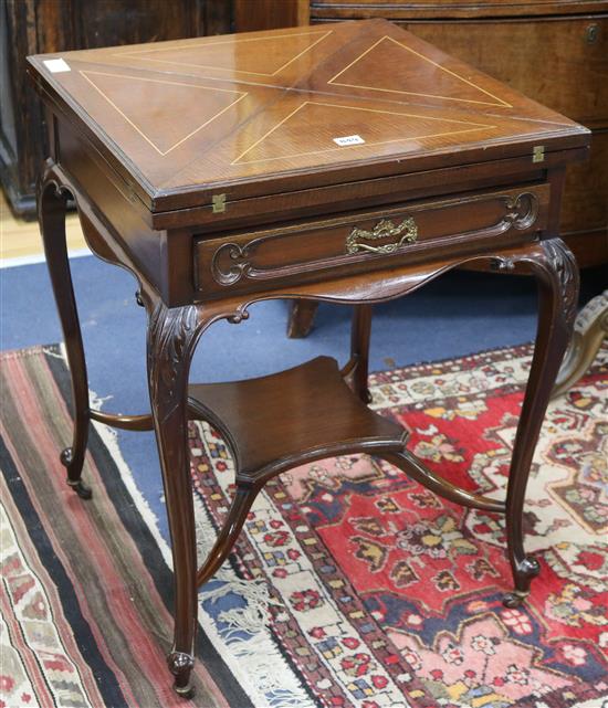 An early 20th century inlaid mahogany envelope card table, W.55cm